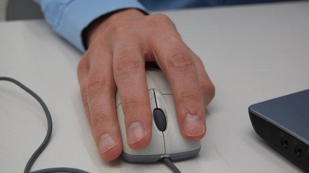 Man holding a computer mouse