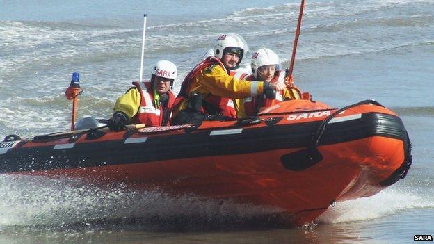 A SARA lifeboat and crew in action