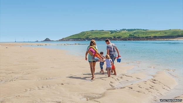 Family working along a beach