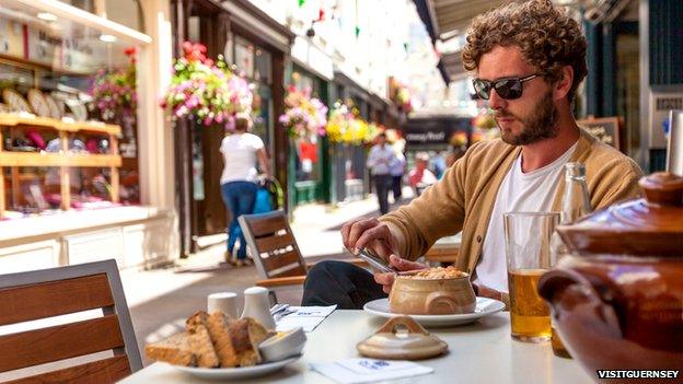 Man at table in St Peter Port