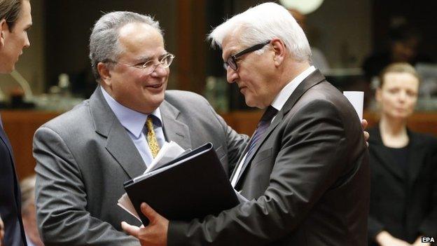 New Greek Foreign Minister Nikos Kotzias meets his German counterpart Frank-Walter Steinmeier before the talks in Brussels.