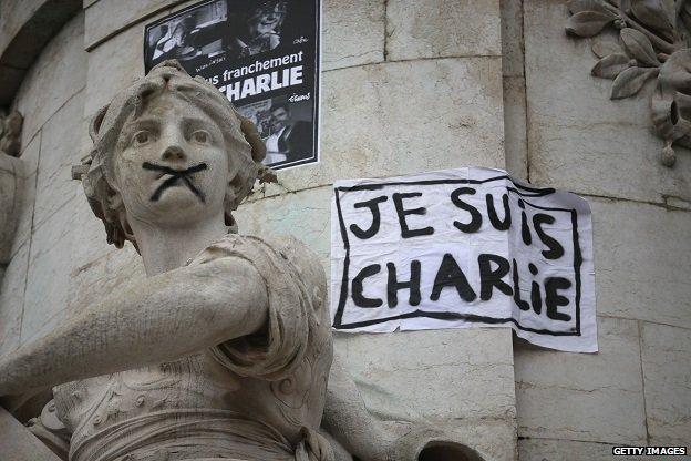 Banners adorn monuments in Place de la Republique on 12 January 2015 after the unity march in Paris