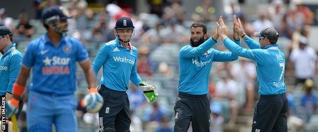 England celebrate the dismissal of Suresh Raina