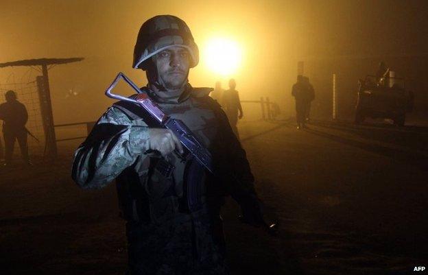 Pakistani soldiers patrol outside the central jail in Multan on January 7, 2015