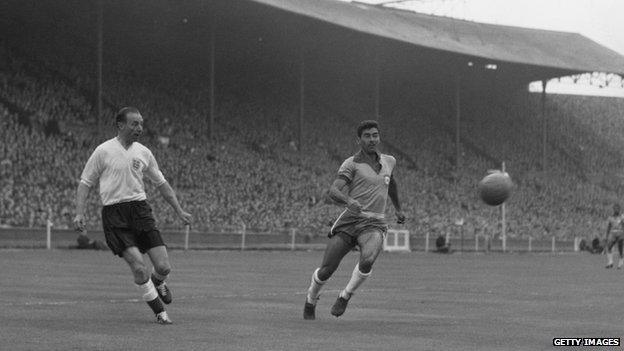 Playing for England against Brazil in 1956