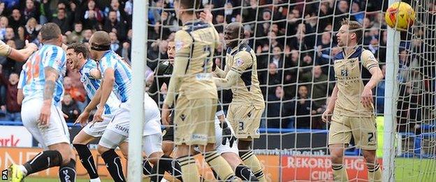 Harry Bunn celebrates his equaliser for Huddersfield against Leeds