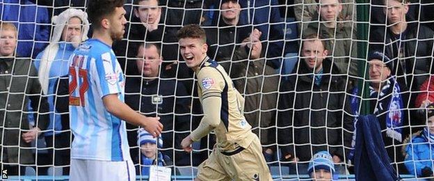 Sam Byram celebrates scoring Leeds United's opener against Huddersfield