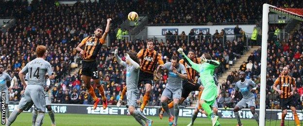 Ahmed Elmohamady of Hull City punches the ball into the Newcastle net