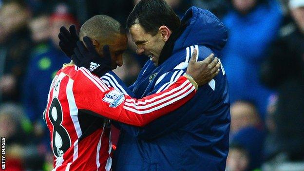 Jermain Defoe celebrates with Gus Poyet