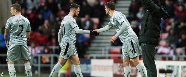 Danny Ings shakes the hand of Lukas Jutkiewicz as he is substituted