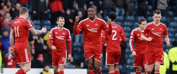 Donervon Daniels celebrates his headed goal for Aberdeen