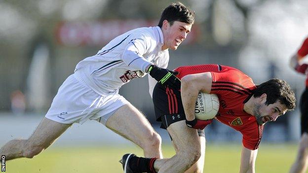 Kildare's Mick O'Grady challenges Down's Kevin McKernan in Newbridge