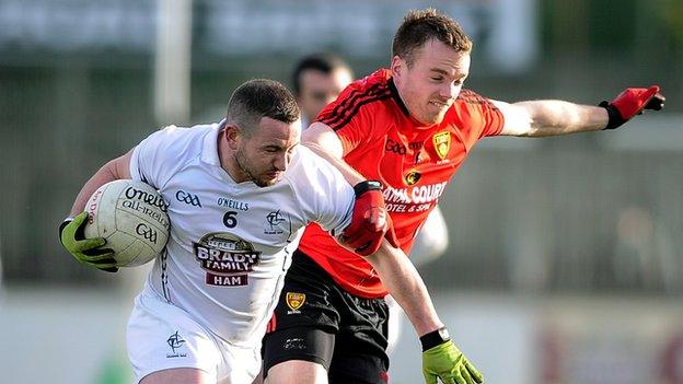 Down's Brendan McArdle battles with Kildare's Daryl O'Brien