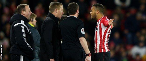 Ryan Bertrand of Southampton squares up to Garry Monk