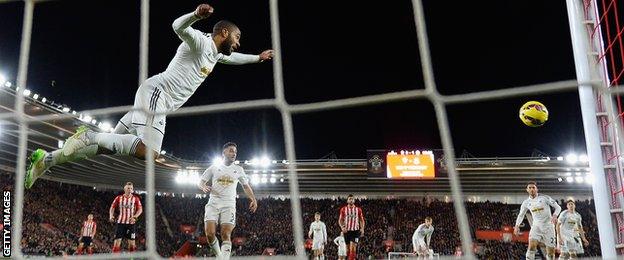 Ashley Williams heads off the line from Sadio Mane