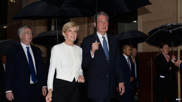 Australian Foreign Minister Julie Bishop (2nd L), British Foreign Secretary Philip Hammond (C) and British Defence Secretary Michael Fallon