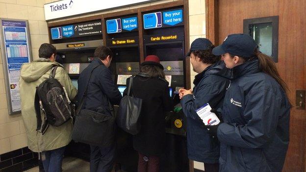 Customers buying tickets at Queensway ticket office