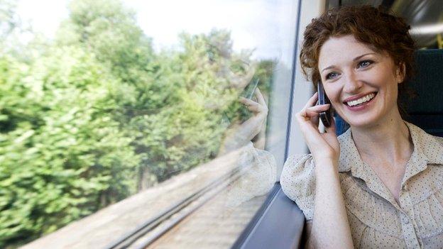 Woman on phone in train