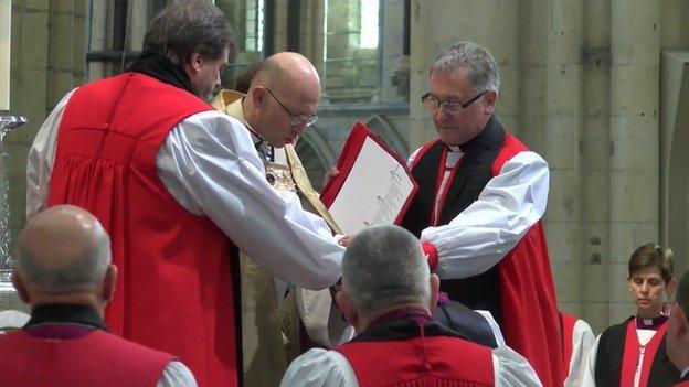 The laying on of hands at the Bishop of Burnley's ordination