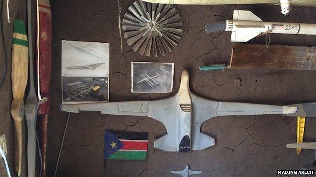 Model aircraft on the wall of George Mel's bedroom/study