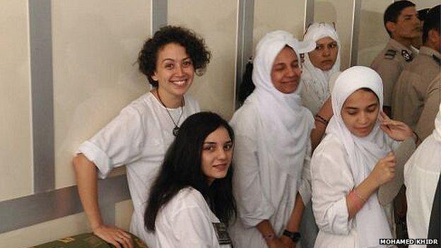 Yara Sallam (back, left) and other defendants