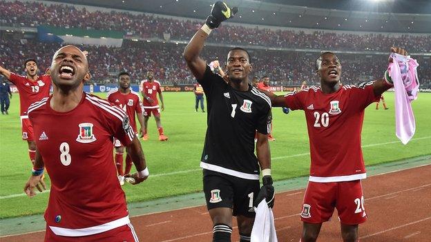 Equatorial Guinea players celebrate with fans after reaching the Nations Cup semi-final