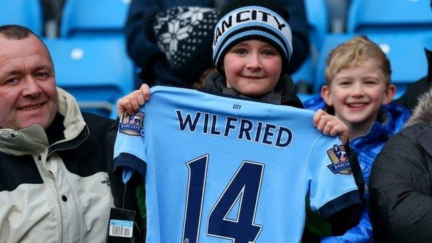 Manchester City fan holds Wilfried Bony shirt