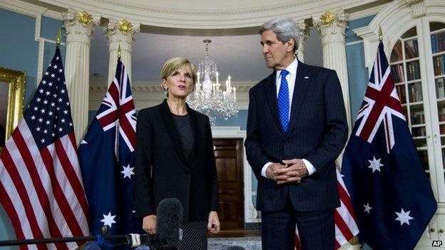 Secretary of State John Kerry listens as Australian Foreign Minister Julie Bishop speaks to reporters at the State Department in Washington, Wednesday, Jan. 21, 2015.