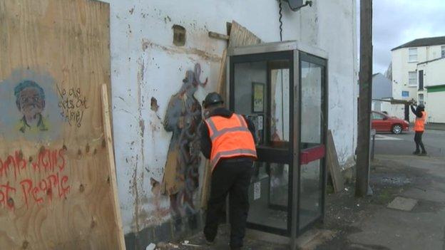 Wooden boards removed from the Banksy mural in Cheltenham