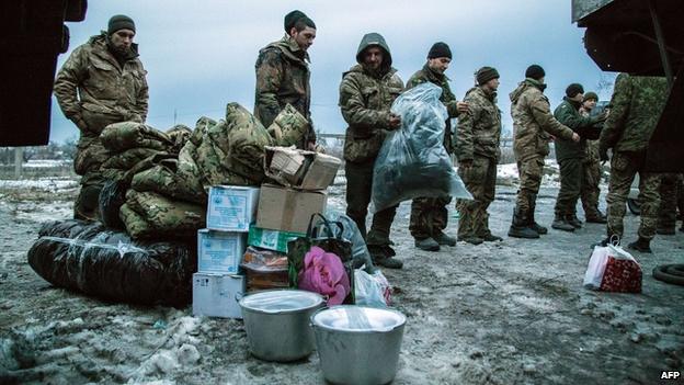 Ukrainian troops with aid delivery