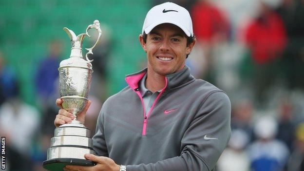 Rory McIlroy holds the Claret Jug