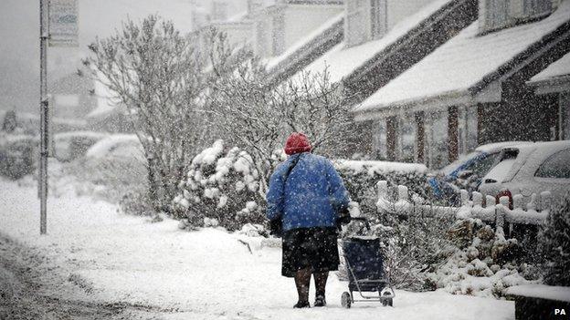 Elderly woman in the snow