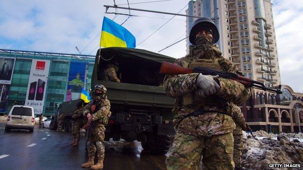 Soldiers with machine guns on patrol in Odessa