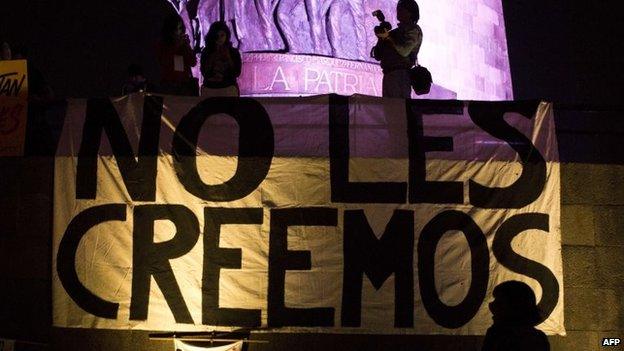 People take part in a march commemorating four months of the disappearance of 43 students from Ayotzinapa, on 26 January, 2015, in Guadalajara City , Mexico.