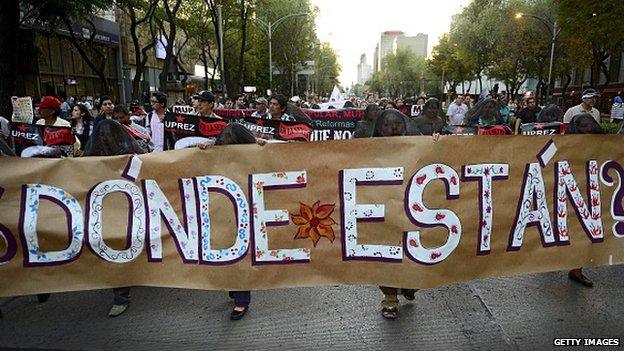 People march in a protest in Mexico City on 5 November, 2014.