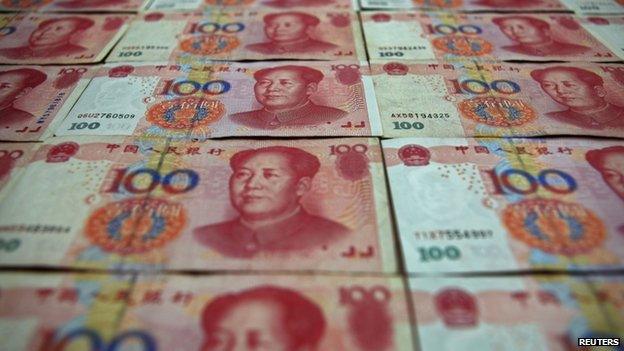 Chinese 100 yuan banknotes are seen in Beijing 7 May 2013.