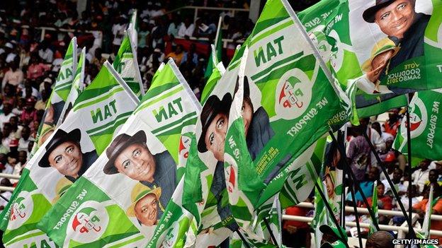 Supporters wave campaign flags of the ruling People's Democratic Party (PDP) candidate Goodluck Jonathan during a rally in Port Harcourt in the Niger Delta region