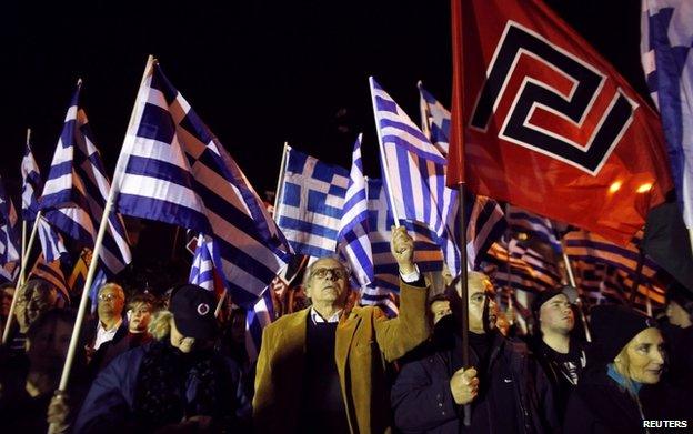 Supporters of the far-right Golden Dawn party wave Greek national and party flags during a rally in Athens January 31, 2015.