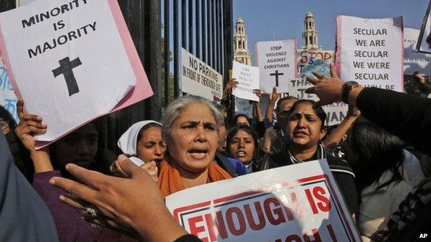 Indian Christians hold placards protesting against recent attacks on churches in the Indian capital as they assemble outside the Sacred Heart Church in New Delhi, India, Thursday, Feb. 5, 2015