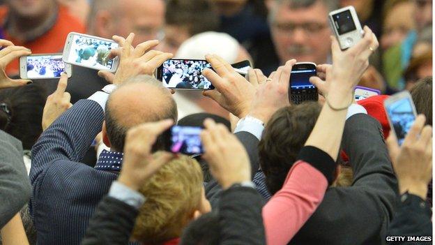 crowd with phones