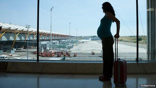 Pregnant woman at the airport