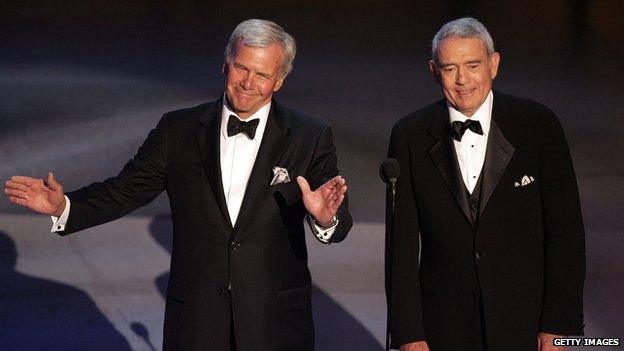 news reporters Tom Brokaw (L) and Dan Rather speak onstage at the 57th Annual Emmy Awards held at the Shrine Auditorium in Los Angeles, California 18 September 2005