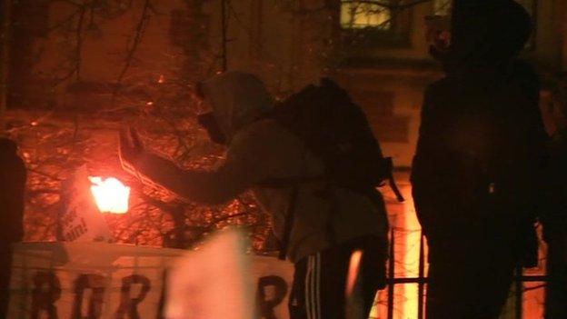 Protestors scaling fence at Oxford Union