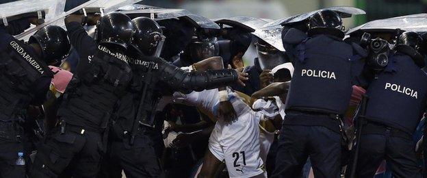 Riot police shield Ghana players