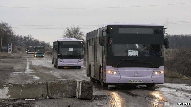 Empty buses head to Debaltseve in eastern to Ukraine on Friday to evacuate civilians caught in fighting between Ukrainian forces and pro-Russian rebels. Signs on the windscreen window read: "Evacuation to Donetsk"