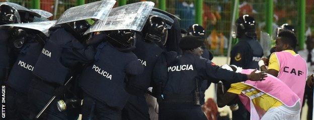 Police shielded Ghana players from objects being thrown from the stands