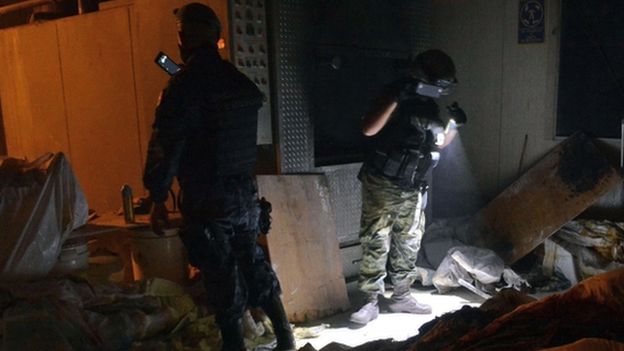 Mexican soldiers work at a private crematorium, where corpses were found in Acapulco, Guerrero State, on 6 February 2015