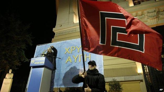 Ilias Panagiotaros, a member of the Greek parliament of the extreme far-right party Golden Dawn, gestures as he talks during a rally in Greece.