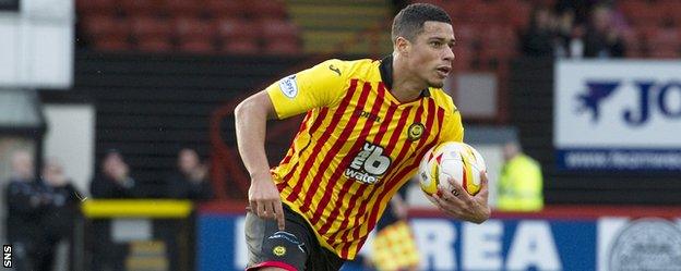 Lyle Taylor celebrates after scoring for Partick Thistle