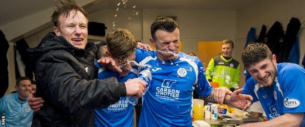 Queen of the South players celebrate in the dressing room after they made the Scottish Cup quarter finals